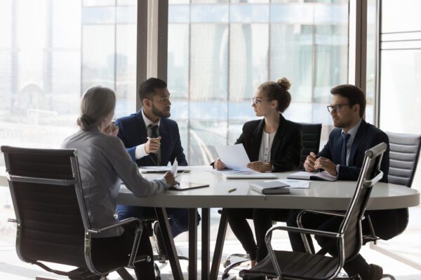 Business team meeting around table.